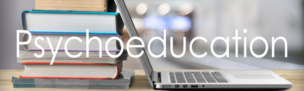 books and laptop with text psychoeducation